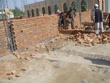 Construction of 8 classroom schools and digging of water wells in image