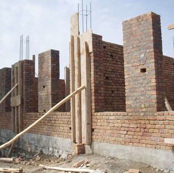 Construction of 8 classroom schools and digging of water wells in image