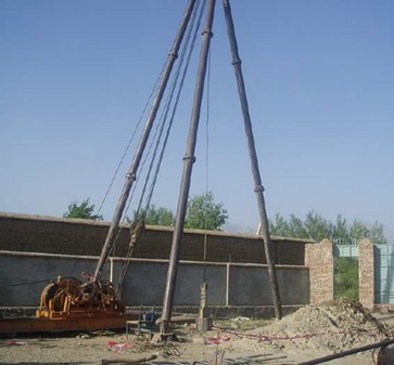 Construction of 8 classroom schools and digging of water wells in image