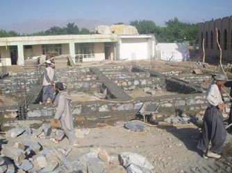 Construction of 8 classroom schools and digging of water wells in image